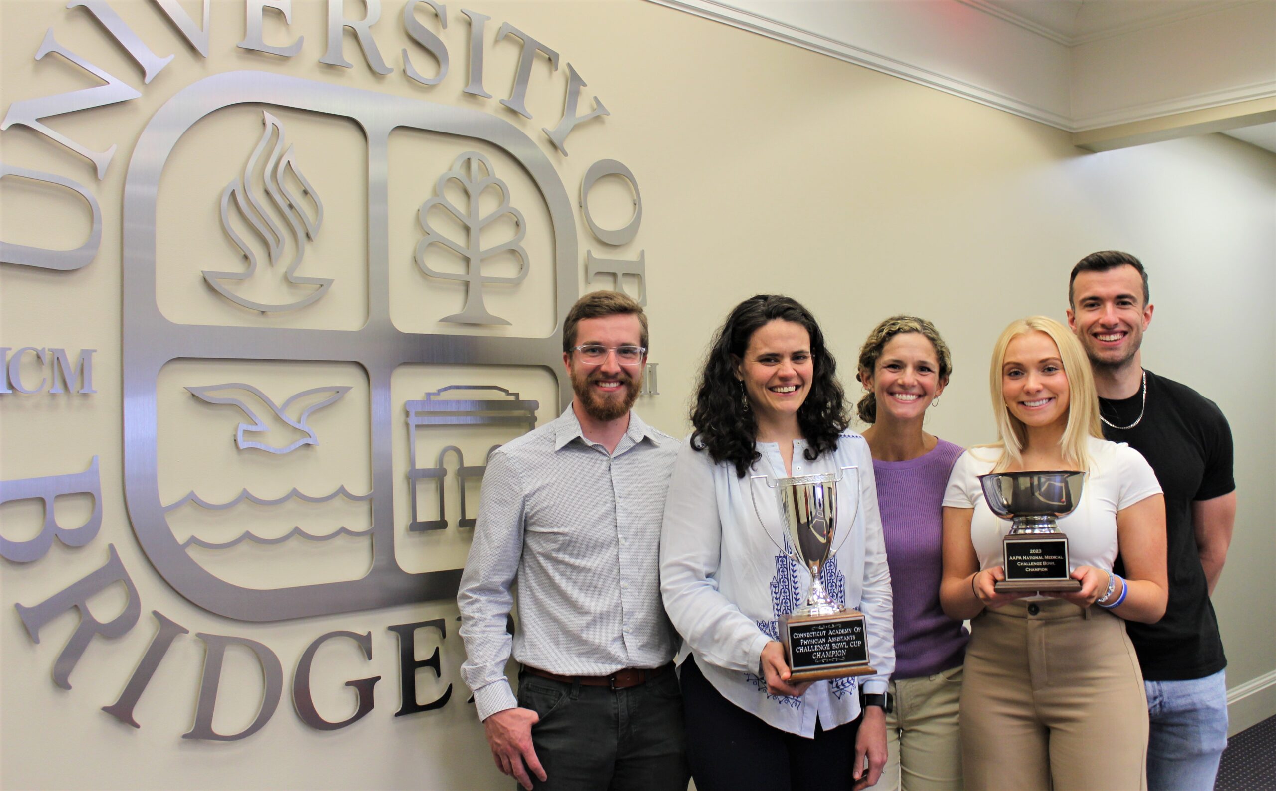 Photo of Juliana Garofalo with the UB PAI team after winning the annual American Academy of Physician Associates (AAPA) Challenge Bowl (2023).