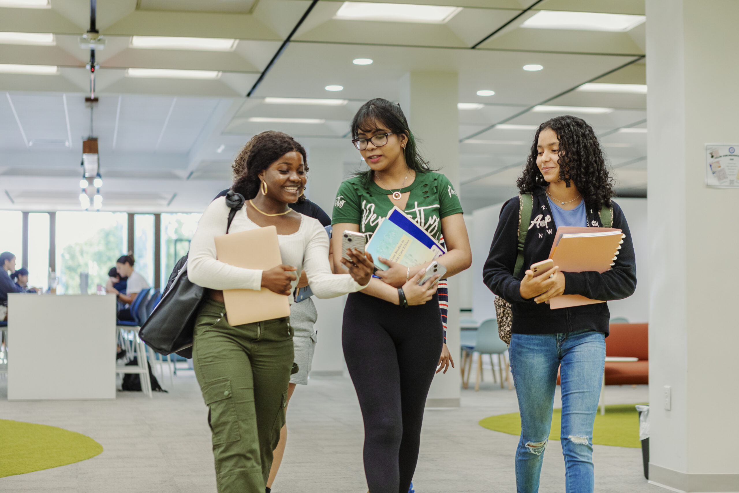 Students walking through the second floor of Wahlstrom Library.