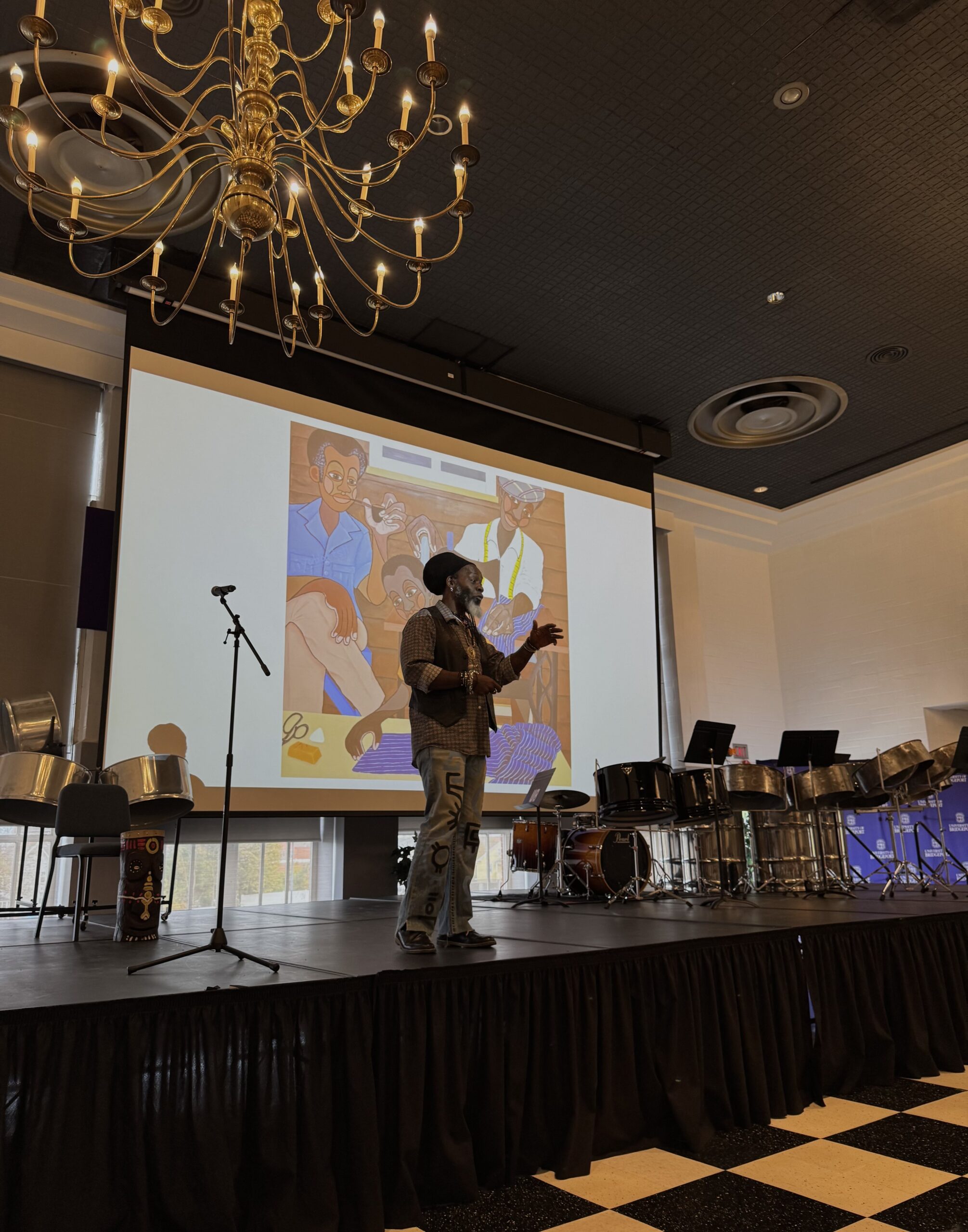 Iyaba Ibo Mandingo speaking on stage at the Necessary Voices event