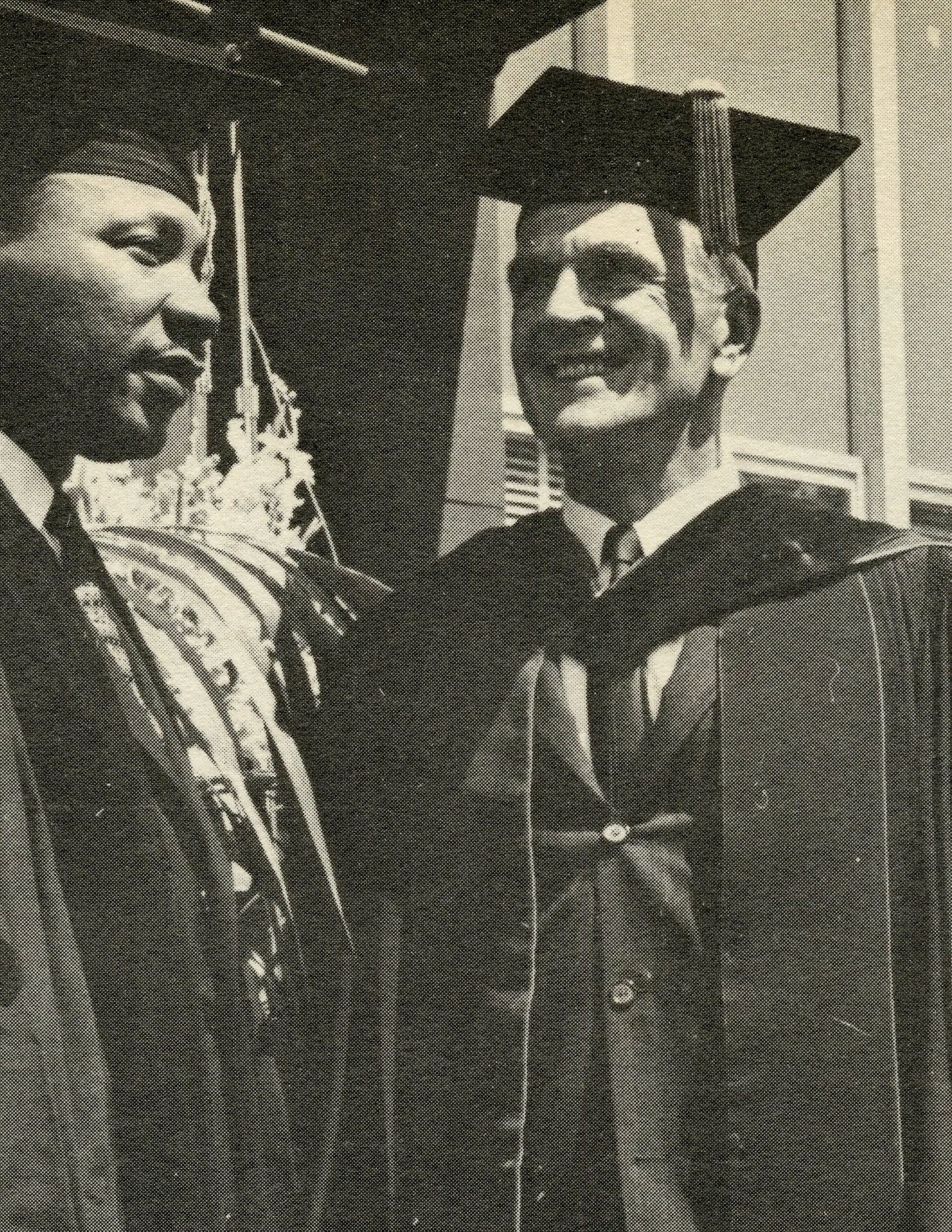 Photograph of Martin Luther King Jr. standing beside University of Bridgeport President James Halsey during the 1961 commencement ceremony.